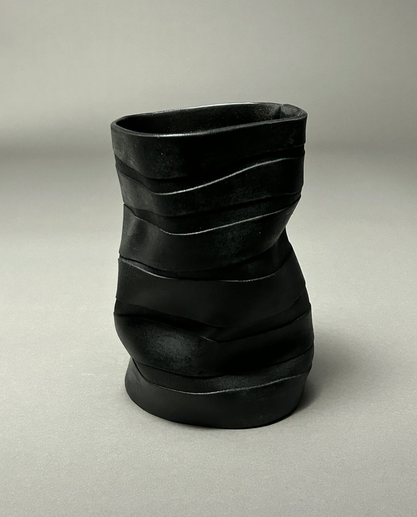 Wavy black textured porcelain vase