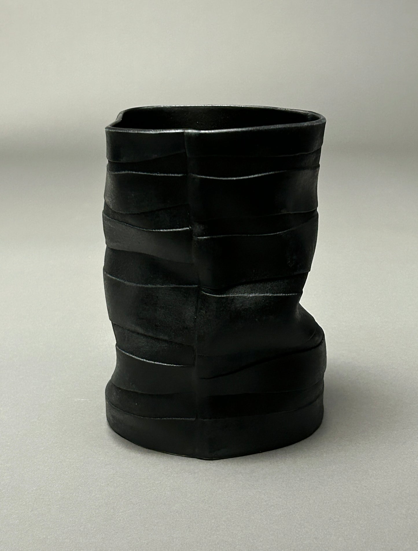 Wavy black textured porcelain vase