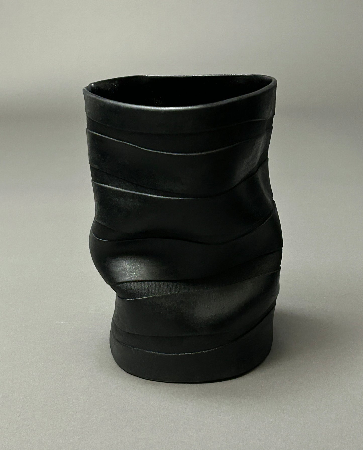 Wavy black textured porcelain vase